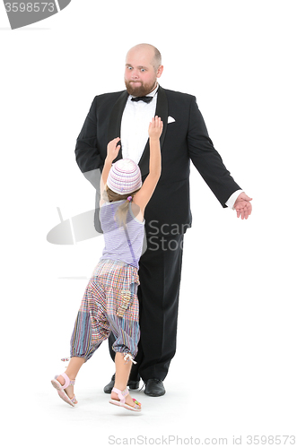 Image of Little Girl and Servant in Tuxedo Have Fun