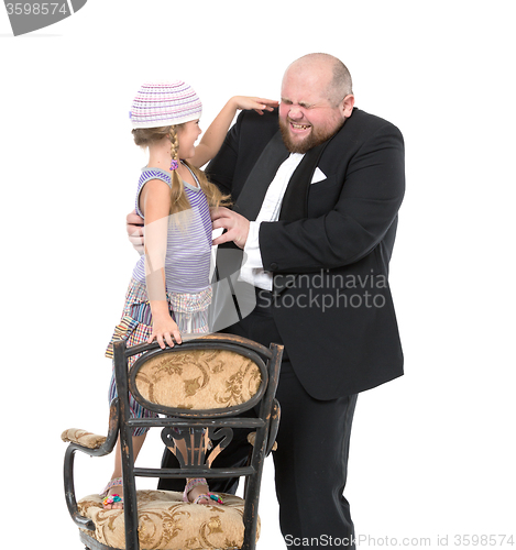 Image of Little Girl and Servant in Tuxedo Have Fun