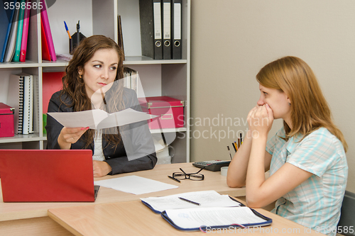 Image of Head scolds specialist office for improperly prepared documents