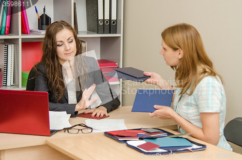 Image of She holds diplomas skilled personnel that she does not want to look