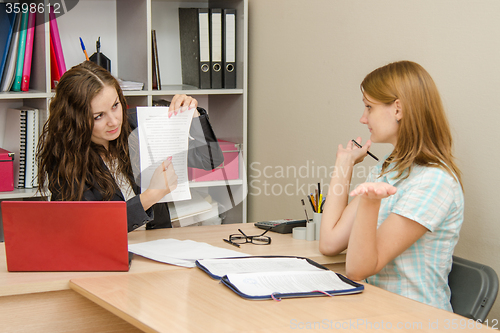 Image of Office Specialist visitor refuses referring to a document in hand