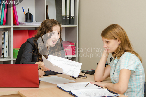 Image of Office worker shouts at visitors and shows her documents