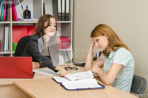 Image of Office worker throwing paper in the client folder