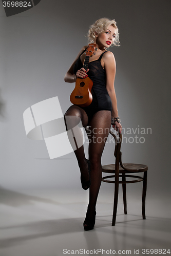 Image of Young Woman With Ukulele