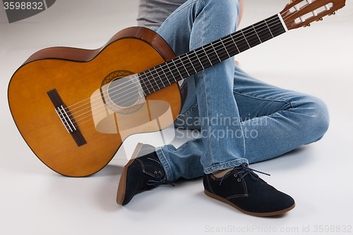 Image of Man\'s Legs And Guitar