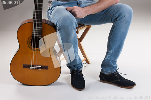 Image of Man\'s Legs And Guitar