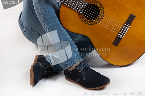 Image of Man\'s Legs And Guitar