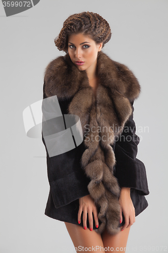 Image of Young Beautiful Woman In a Fur Coat