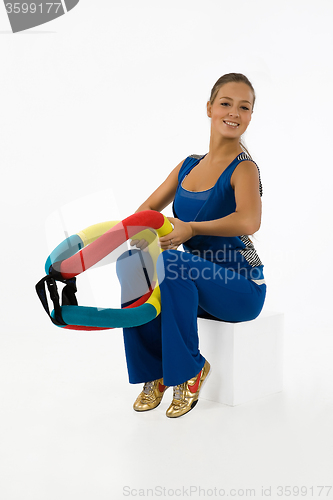 Image of Young Woman And Training Device
