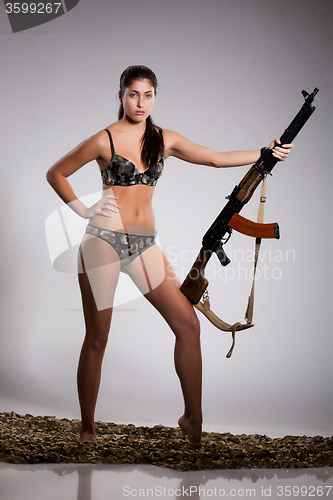 Image of Young Woman With Light Machinegun