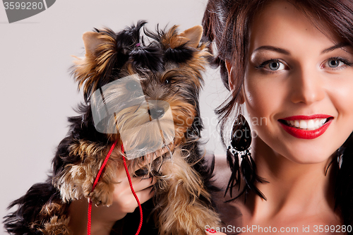 Image of Young Woman With A Little Dog