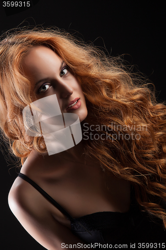 Image of Young Red- Haired Woman In Black Lingerie