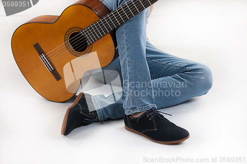Image of Man\'s Legs And Guitar