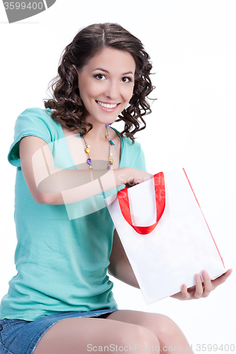 Image of Young Emotional Woman With Paper Bag