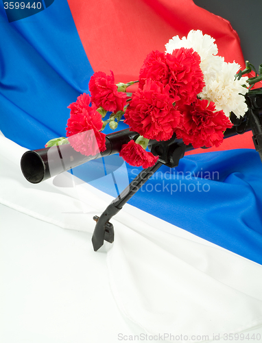 Image of Machinegun And Flowers