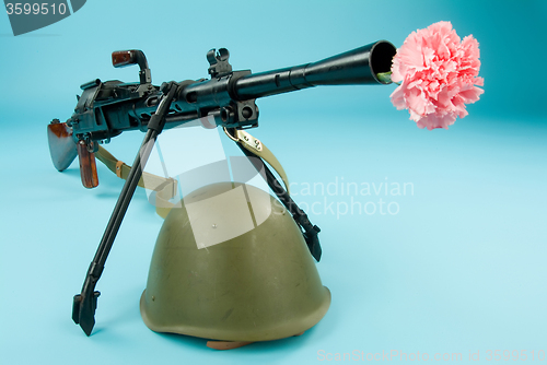 Image of Machine Gun And Flowers