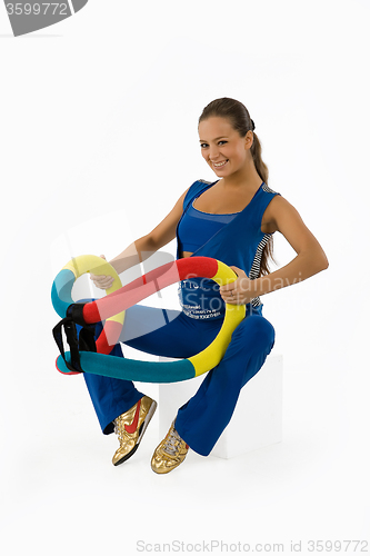 Image of Young Woman And Training Device