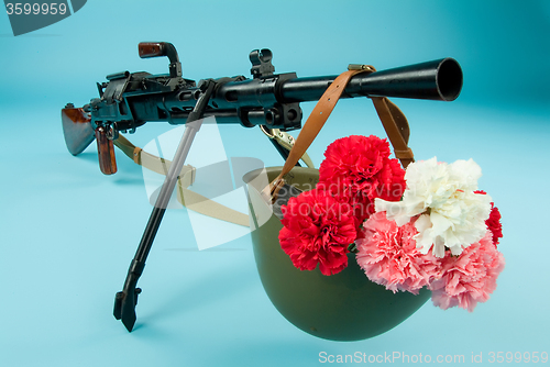 Image of Machine Gun And Flowers