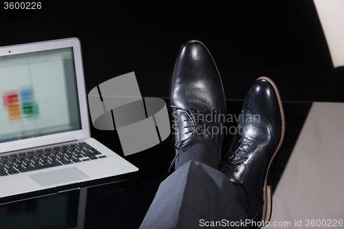 Image of Man\'s Legs And Notebook