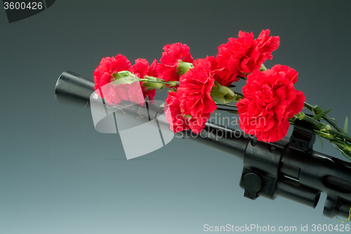 Image of Machinegun And Flowers