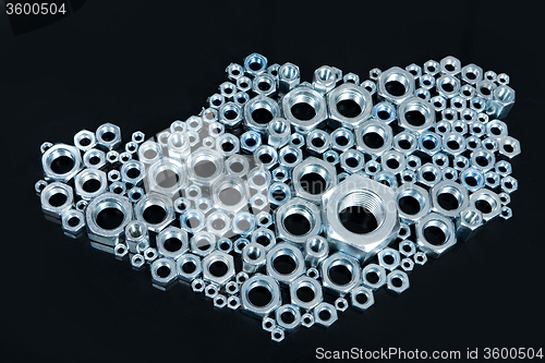Image of Screws On A Black Glass