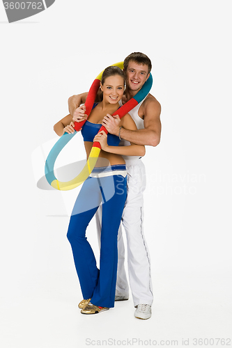 Image of Young Woman And Man With Training Device