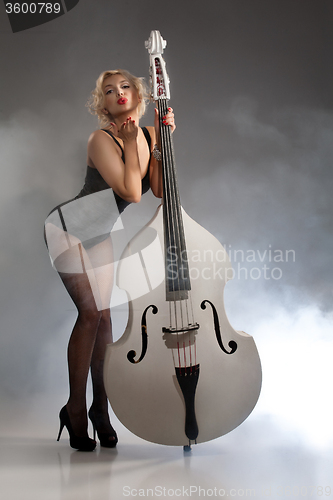 Image of Young Woman In Lingerie With A Double Bass