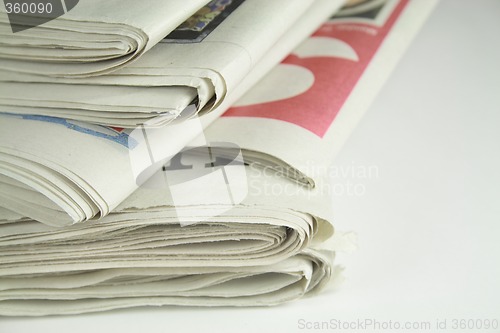 Image of pile of daily newspapers