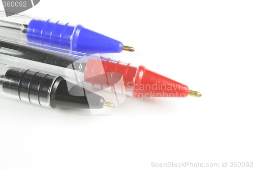 Image of three different coloured ball point pens