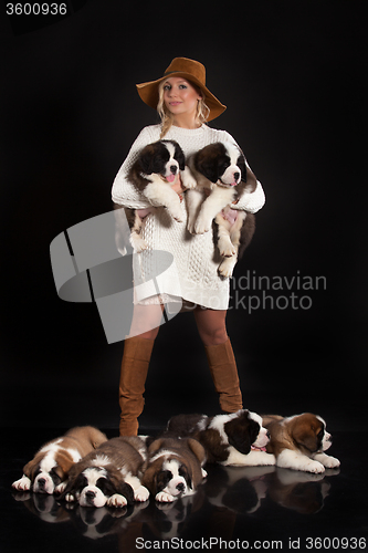 Image of Young Woman With Little St. Bernard