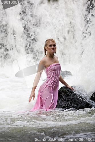 Image of Young Nude Woman Swimming