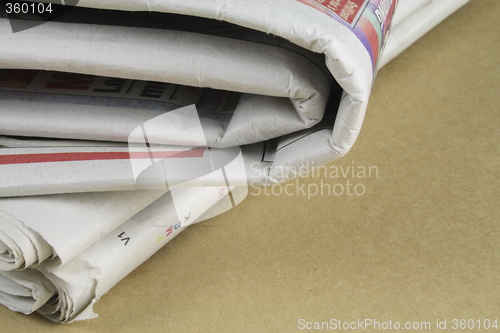 Image of pile of daily newspapers