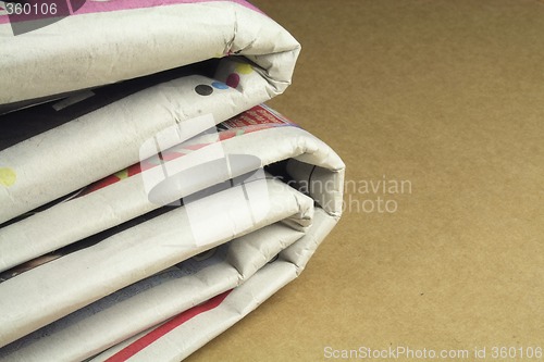 Image of pile of daily newspapers