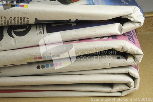 Image of pile of daily newspapers