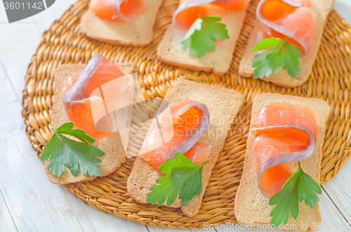 Image of toasts with salmon and parsley
