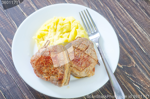 Image of mashed potato and fried meat