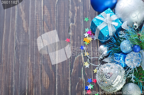 Image of christmas decoration on wooden background