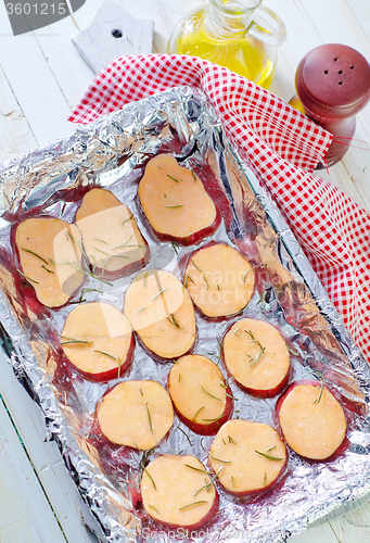 Image of sweet potato with rosemary on the foil