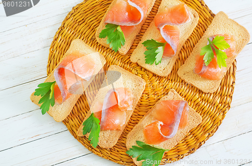 Image of toasts with salmon and parsley