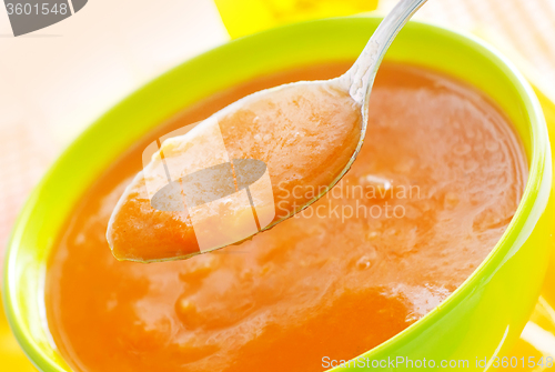 Image of Fresh soup from pumpkin in the green bowl