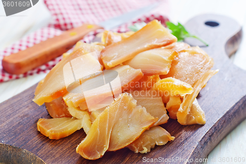 Image of smoked fish on board