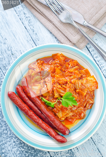 Image of sausages with fried cabbage