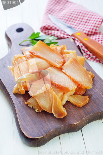 Image of smoked fish on board