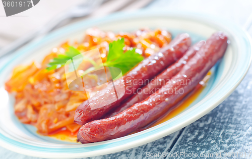 Image of sausages with fried cabbage