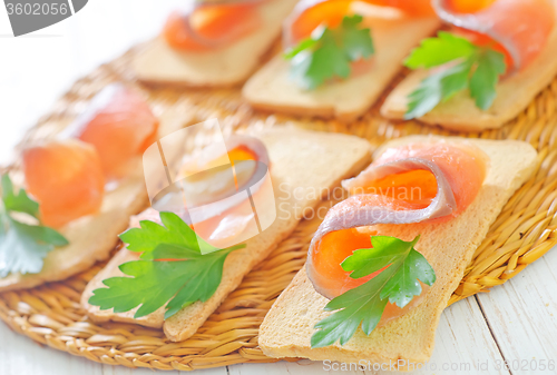 Image of toasts with salmon and parsley