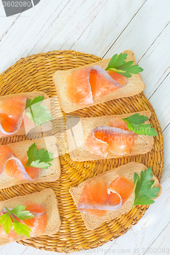 Image of toasts with salmon and parsley