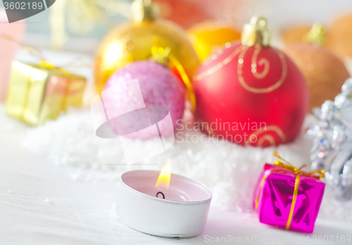 Image of Candle and christmas decoration