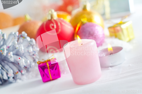 Image of Candle and christmas decoration