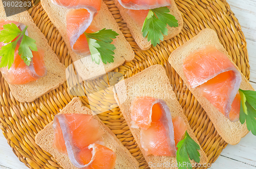 Image of toasts with salmon and parsley
