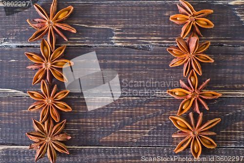 Image of anise on wooden board